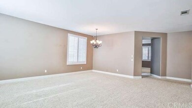 Living room and formal dining area painted in neut