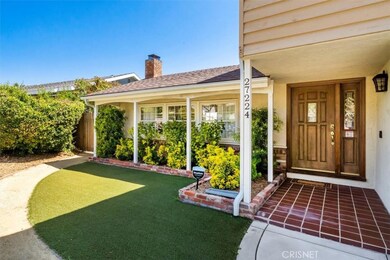 Gorgeous drought tolerent plants and artificial grass in front
