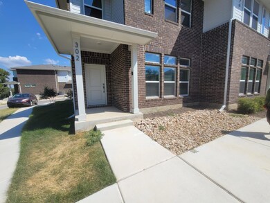 Doorway to property with brick siding