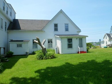 Back of house and lawn. Red steps...