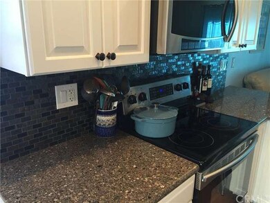 solid quartz countertops and mosaic glass and tile