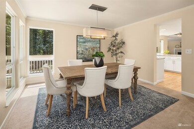 The formal dining room has peaceful views of the greenbelt.