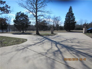 Concrete Circular Drive which leads to back of property and exits out the side of property back to main drive 