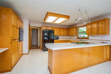 The kitchen has lots of cabinet storage and counter space for preparing and serving. You also have a wonderful view of the backyard while washing dishes.