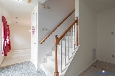 Staircase featuring carpet and baseboards