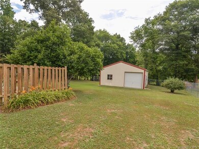 Large fenced area with total acreage of over an ac
