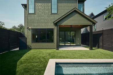Rear view of property featuring ceiling fan, a pa