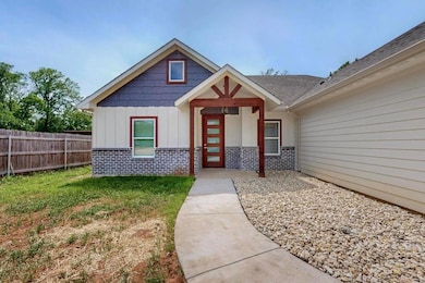 Property entrance featuring fence