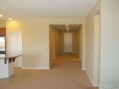 LOOKING BACK TO THE FRONT ENTRANCE WITH KITCHEN, P