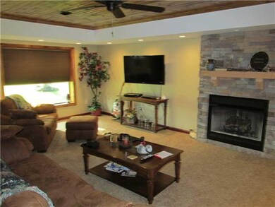 Family Room. Gas Fireplace with Stone Wall.