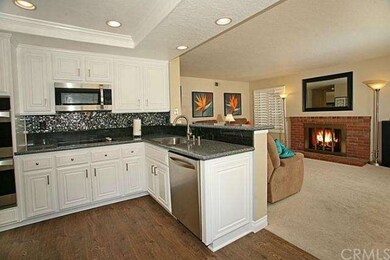 Granite counters, glass backsplash and opens to fa