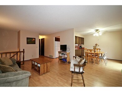 Open floor plan to living room, dining room and ki
