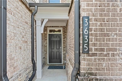 Entrance to property with brick siding