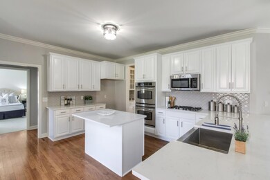 Beautiful Quartz counters in completely remodeled kitchen. Stainless steel appliances