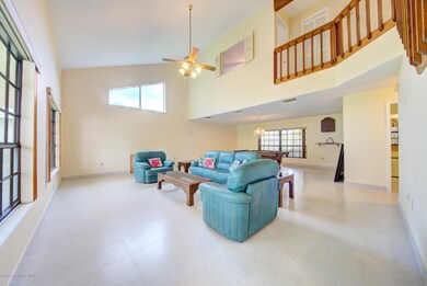 living room with balcony above