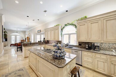 Expansive chef’s kitchen opens to the breakfast an