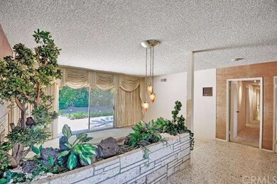 Built-in stone planter off entry.