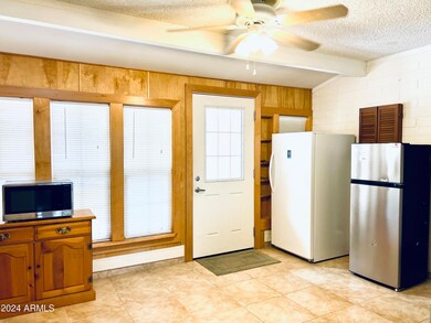 DINING TO AZ ROOM AND DOOR TO BACKYARD