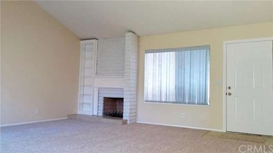 Entry, large living room,  fireplace, & built-in s