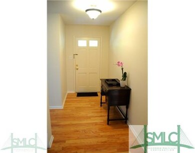 Foyer. Freshly painted with new hardwood floors.