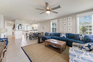 The spacious living room flows seamlessly into the
