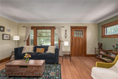 The living room still has its original windows.  Most other windows are newer. Beautiful front door.