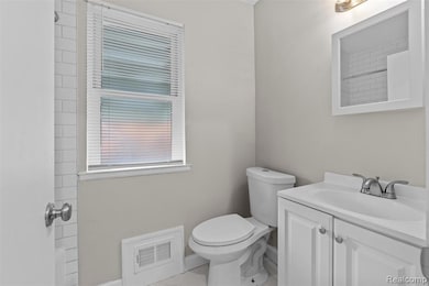 Full bathroom featuring vanity and a shower