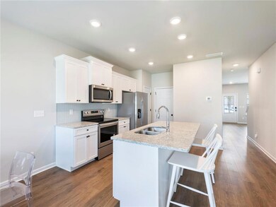 Kitchen with appliances with stainless steel finis