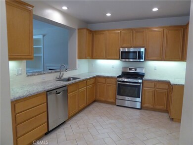 Maple cabinetry, all new s.s. appliances, new backsplash and slab granite!