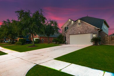 Another view of your fabulous yard. Long Double Driveway offers extra Parking to the 2 car garage. Both sides offer space between neighboring homes.