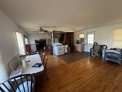 Dining space featuring dark wood finished floors, 