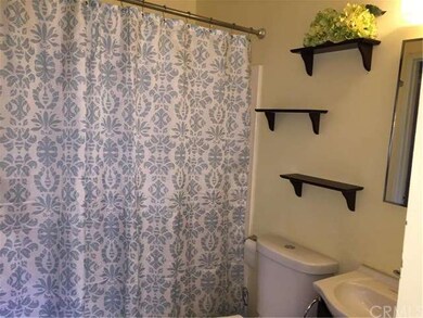 Bathroom also includes a tub/shower combination.