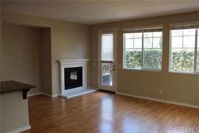 Family room and open kitchen layout.  Gas fireplac