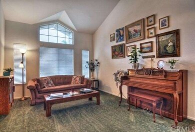 Formal living room with vaulted ceilings