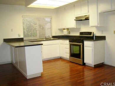 Kitchen has new countertop, new sink and faucet wi