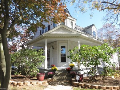 This 1880 Victorian home with open front porch is 