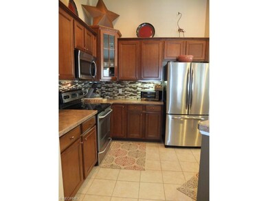 Kitchen has tile floor.