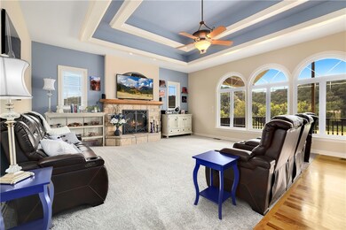 Spacious living room with vaulted ceilings and scenic views.