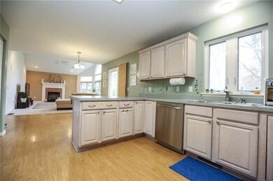 open kitchen to eat-in area and family room and sl