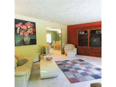 The living room leads into the formal dining room.