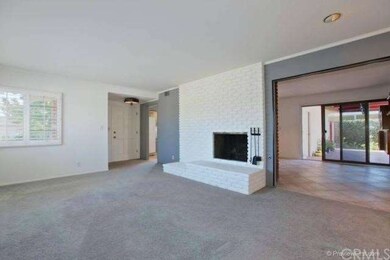Cozy living room with fireplace and plenty of ligh