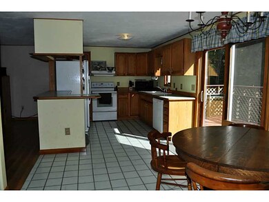 Kitchen. Tiled kitchen with slider to deck.  Appli