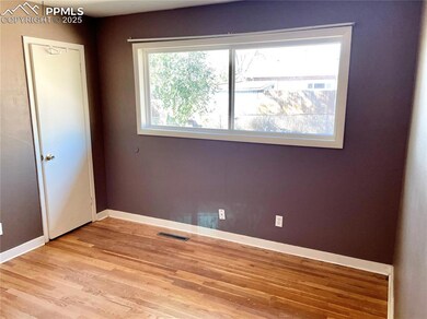Unfurnished room featuring baseboards, visible ven
