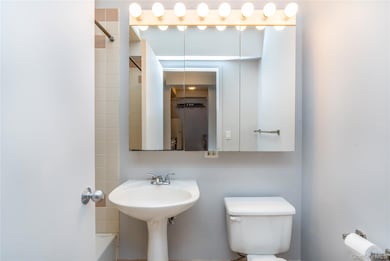 Bathroom featuring shower / tub combo and toilet