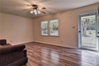 Family Room with laminate floors has plenty of spa