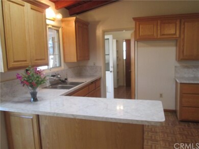 Maple cabinets,formica counter tops vaulted ceilin
