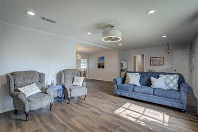 Living room with hardwood / wood-style flooring, a