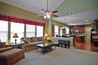 This photos shows the open floor plan with the kitchen adjacent to the great room