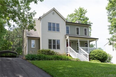 View of front of house featuring a front lawn, a c