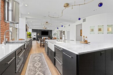 Kitchen featuring open floor plan, a spacious isla